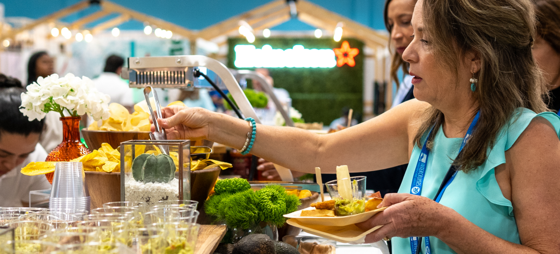 Woman serving herself food from buffet